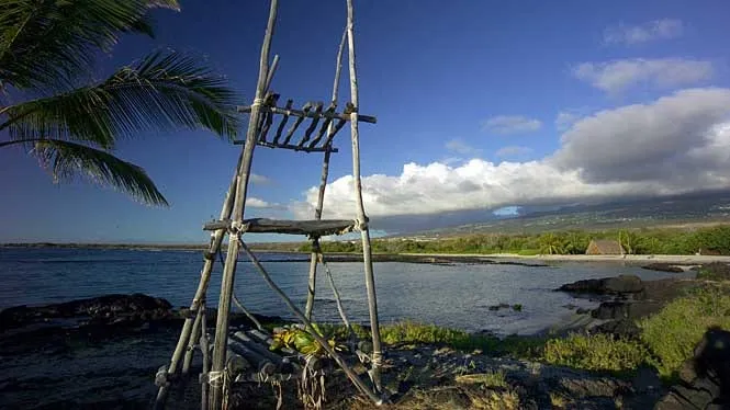 A lashed-pole fishing shrine on the lava shoreline of Aiopio Beach at Honokohau, Kona.