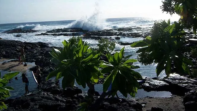 Surf breaking over the lava tide pools at Wawaloli Beach near the Kona airport.