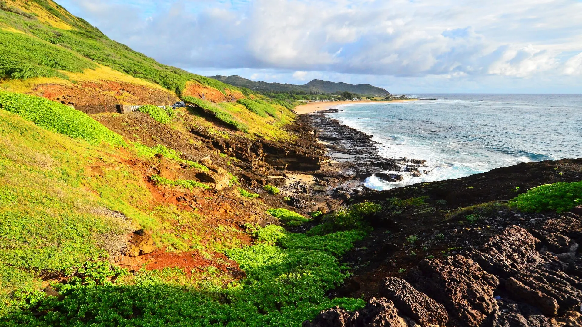 The small sandy pocket beach of Halona Cove between two lava points on Oahu.