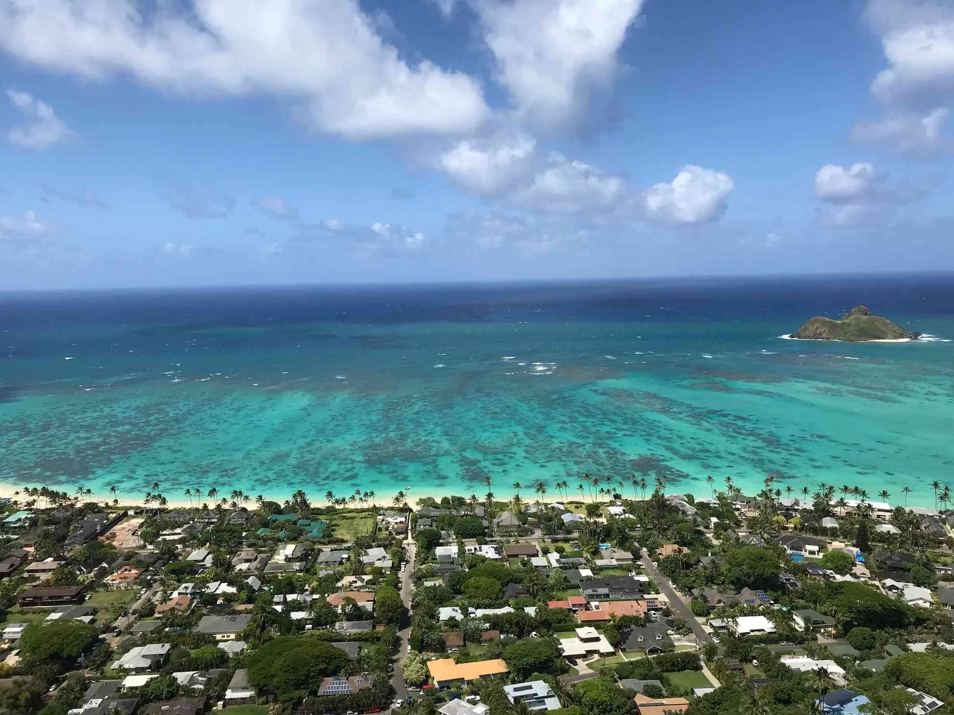 Aerial view of Kailua Beach, its turquoise water and the town behind it on Oahu.