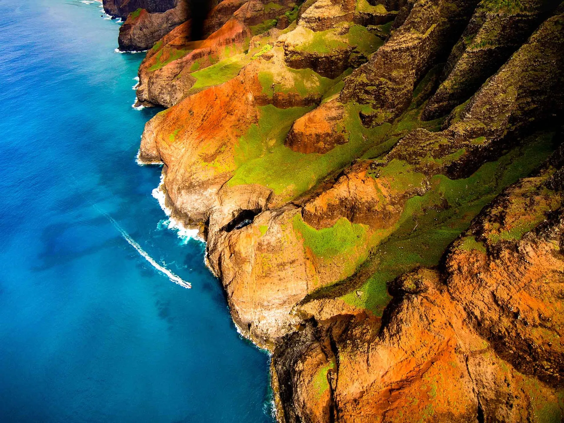 Aerial view of the fluted green cliffs of Kauai’s Na Pali Coast.