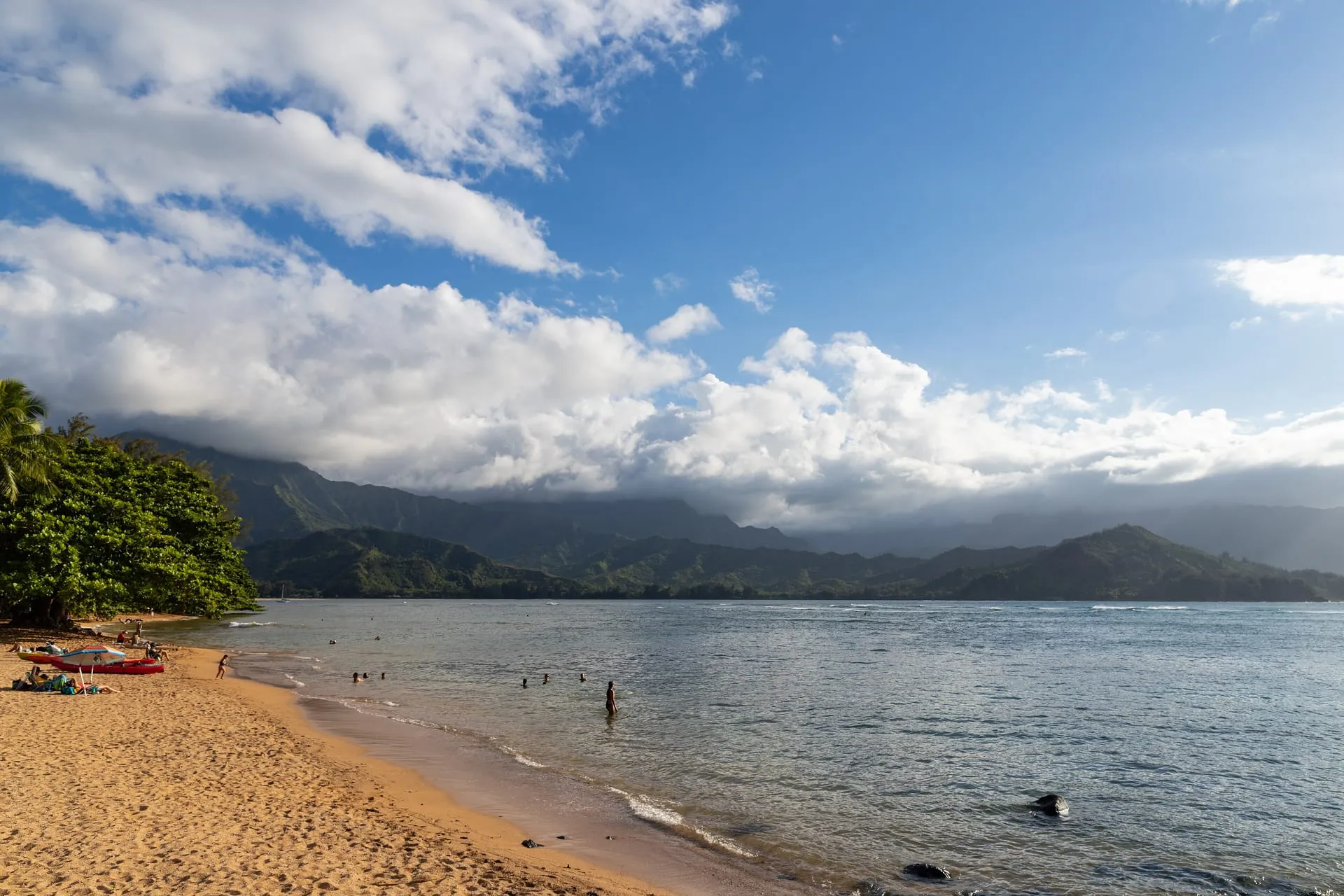 Puu Poa Beach at Princeville, looking across Hanalei Bay to the mountains.