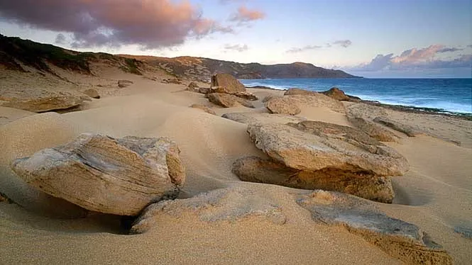 Wind-sculpted sandstone and dunes above Moomomi Beach on Molokai’s north-west coast.