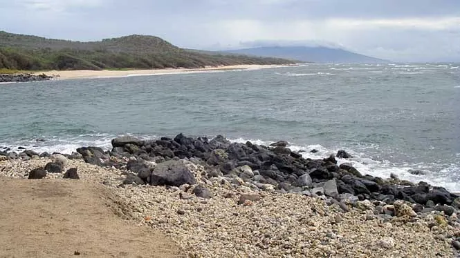 Boulders and the sheltered water of Sandy Cove on Molokai’s south-west shore.
